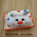 Hand painted cow shaped ceramic bread plate with flower